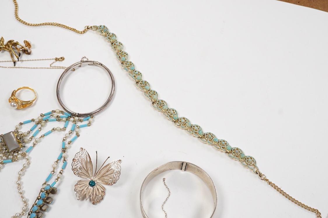 A 9ct and cabochon black onyx set pendant, on a 9ct chain, a 9ct and gem set ring and pair of 9ct and cultured pearl set ear clips, together with other items including costume jewellery, a silver bangle and a silver book